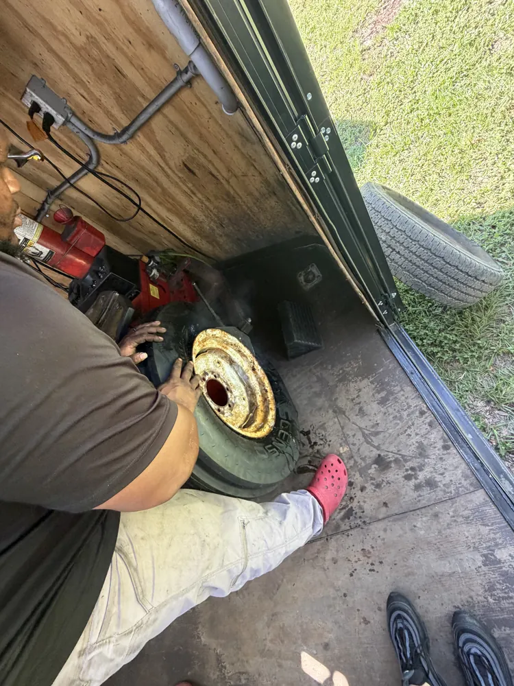 Farm implement wheel being changed at the Taylor Mobile Tire Service trailer